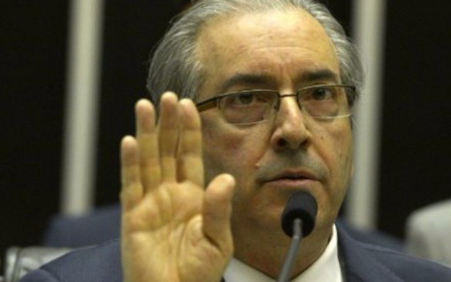 O deputado Eduardo Cunha (PMDB-RJ) na sessão em que leu o pedido de impeachment da Dilma: segundo a presidente, o parlamentar fez um achaque ao Planalto. Foto: Agência Brasil